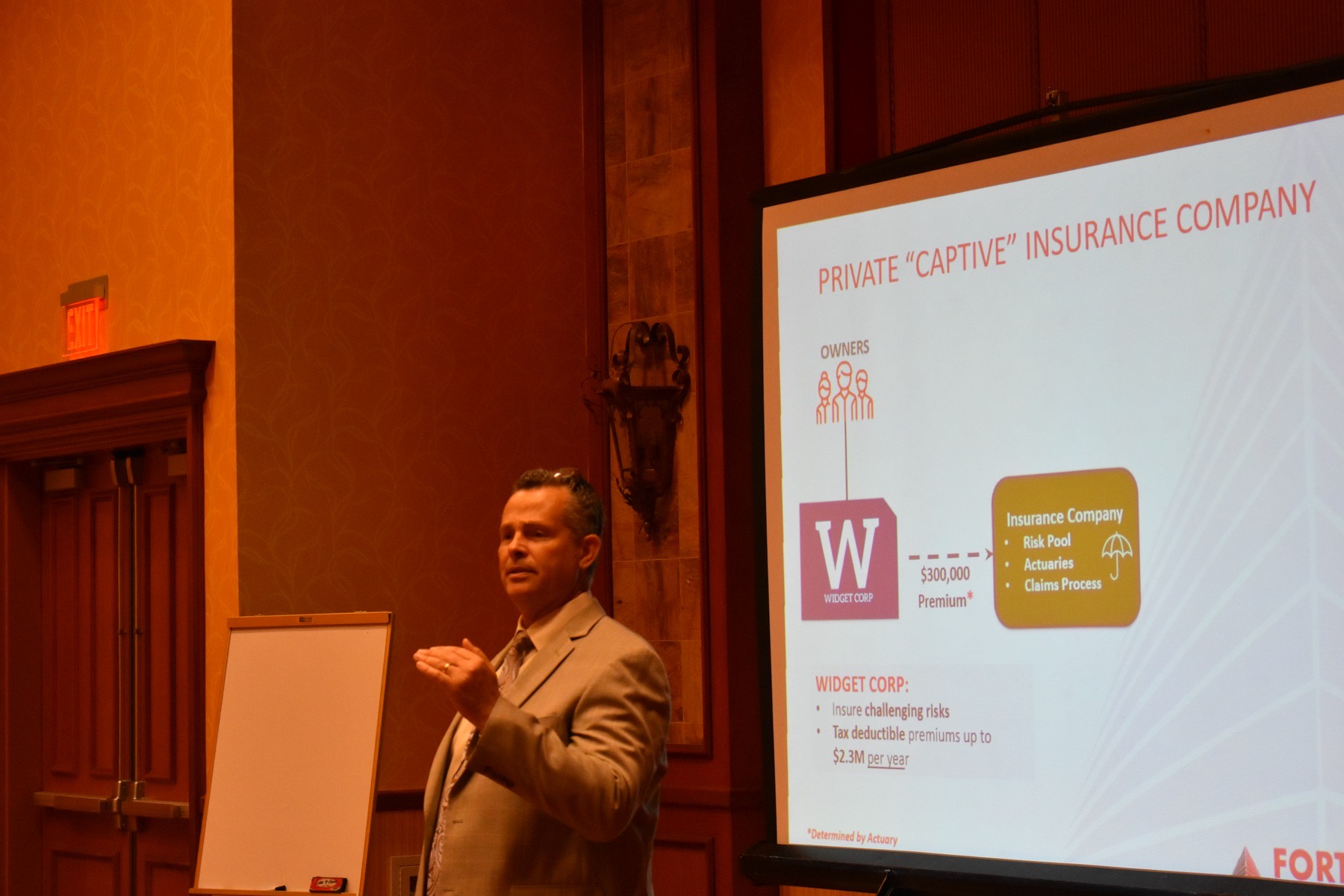 A Fortress principal teaching a room of business owners and advisors
